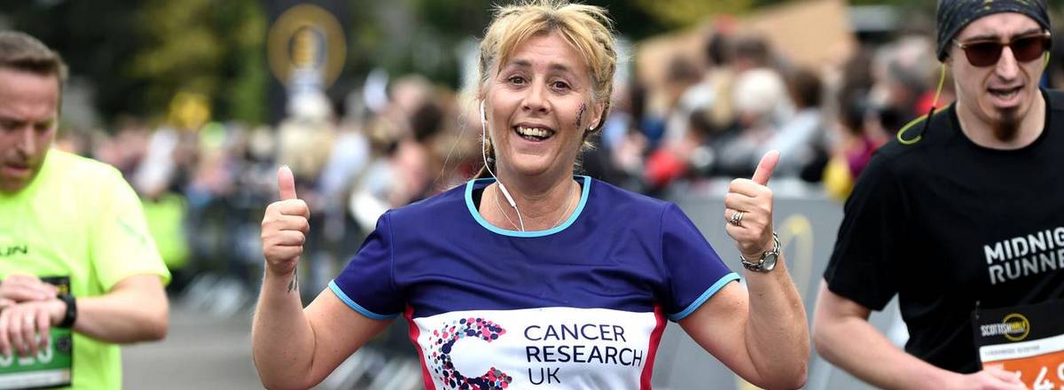 Runner in cancer research shirt