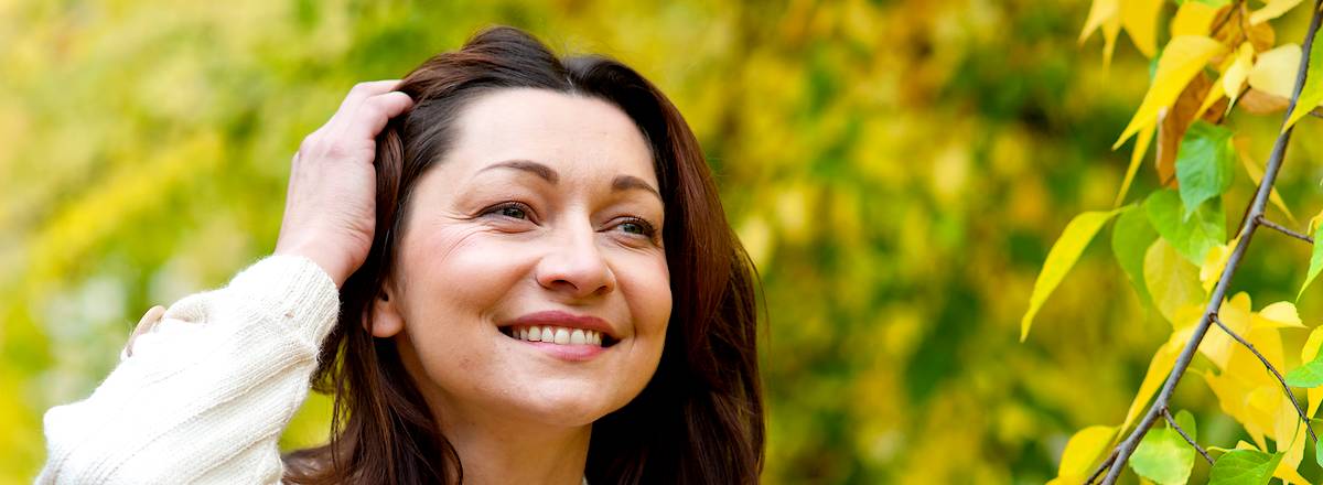 Woman with fine smile in park