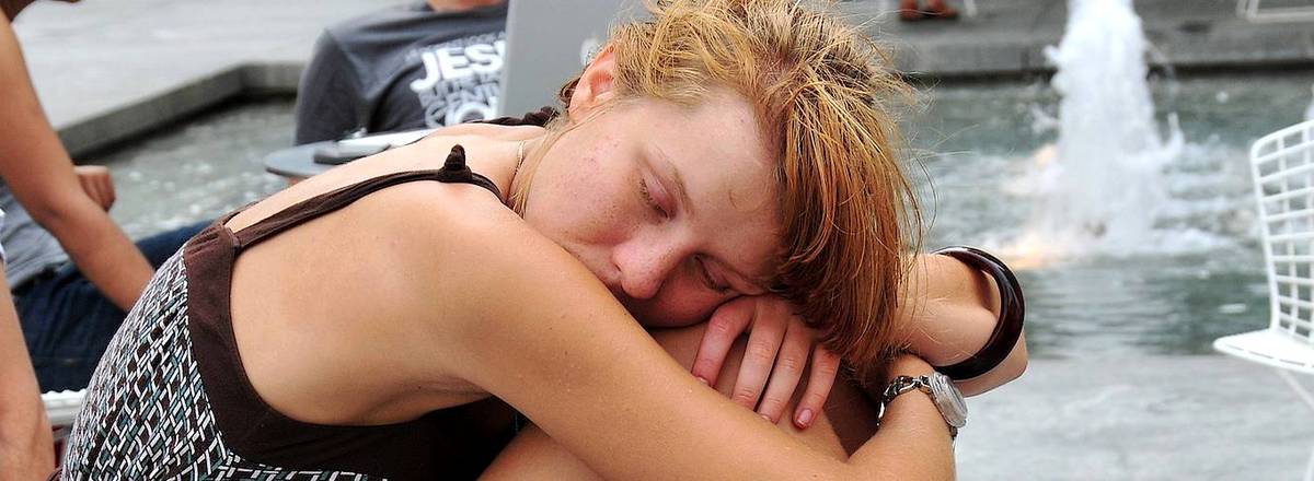 Woman in daytime looking tired