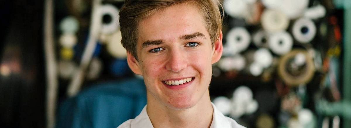 Young man smiling in clubroom